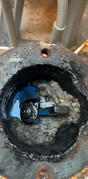 Picture of the inside of a valve that feeds waste from one pump station to another.  It is full of "flushable wipes" which are not actually flushable.